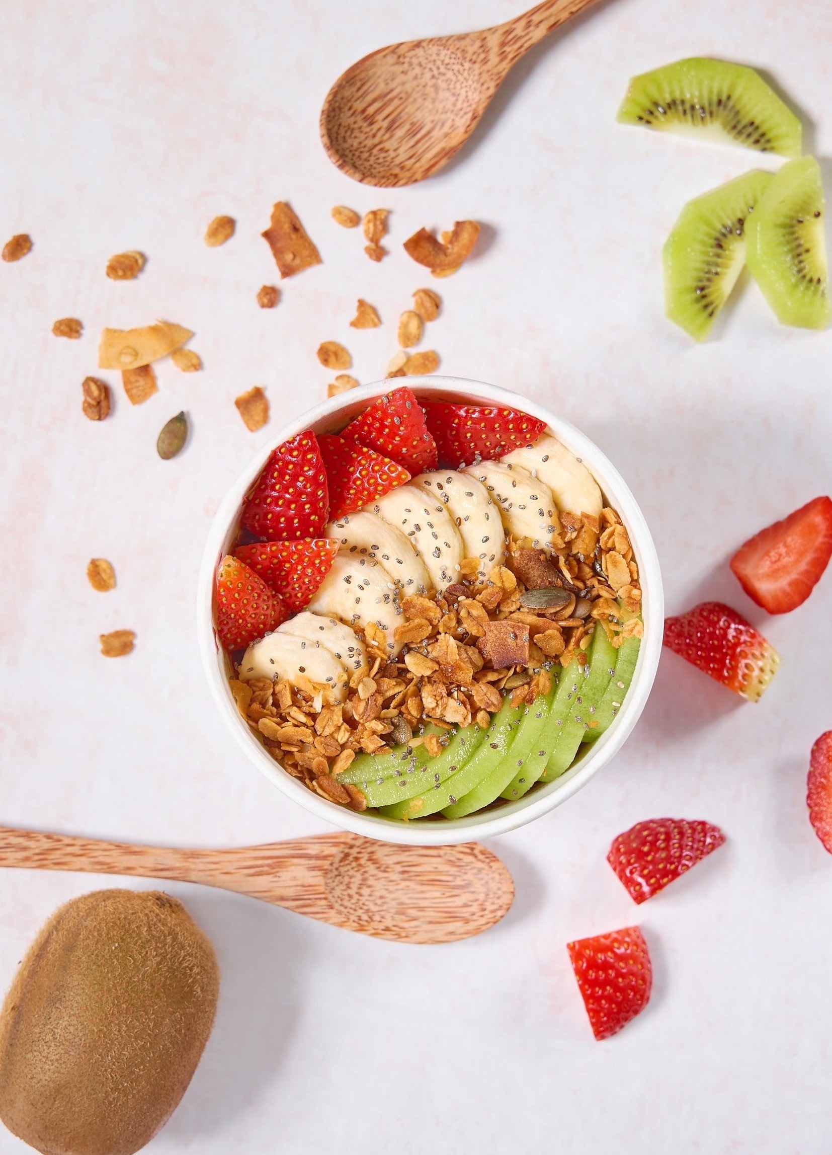 Slices of Delicious Mixed Fruits with Nuts and Flax Seeds in a Bowl
