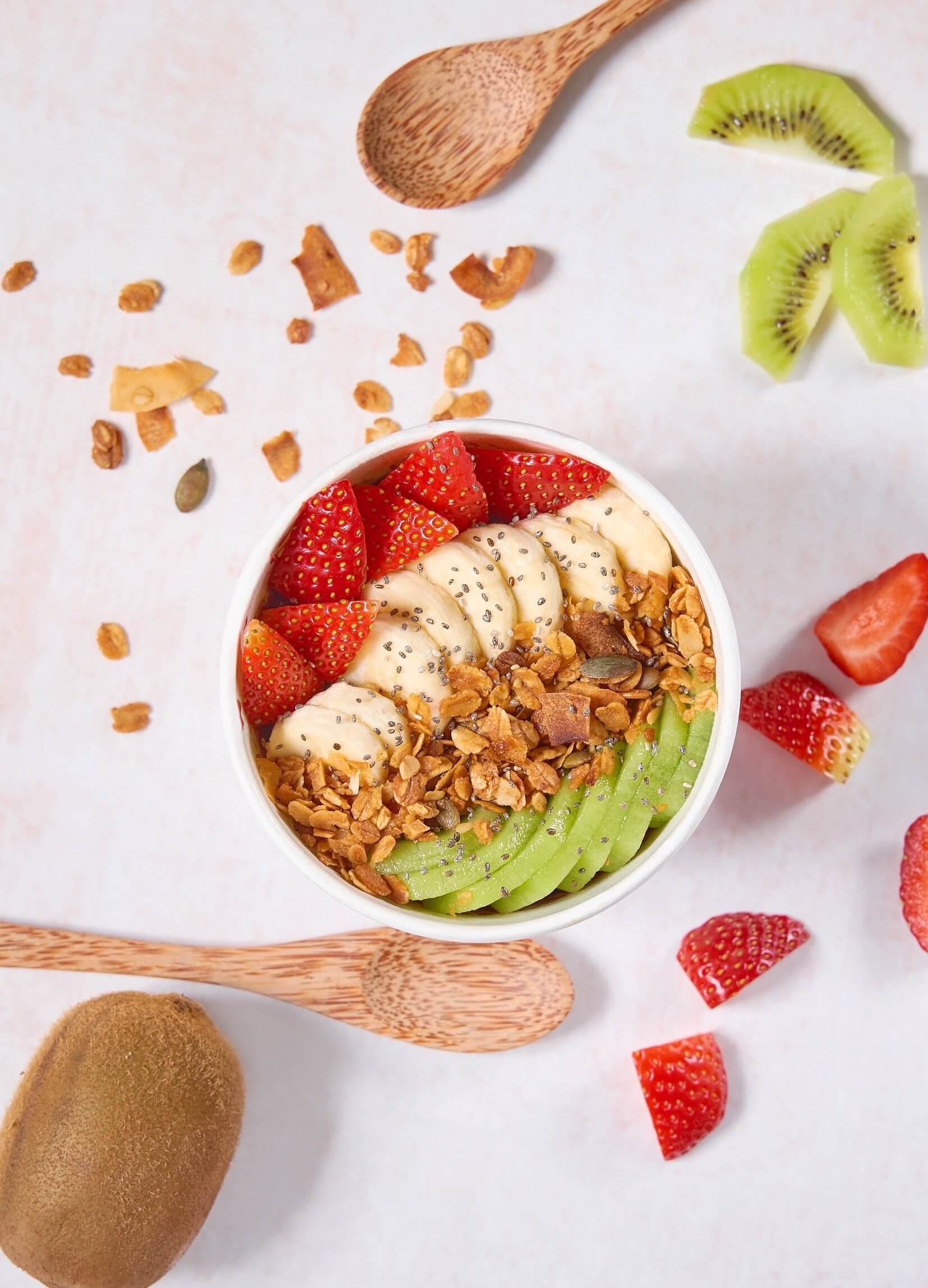 Slices of Delicious Mixed Fruits with Nuts and Flax Seeds in a Bowl